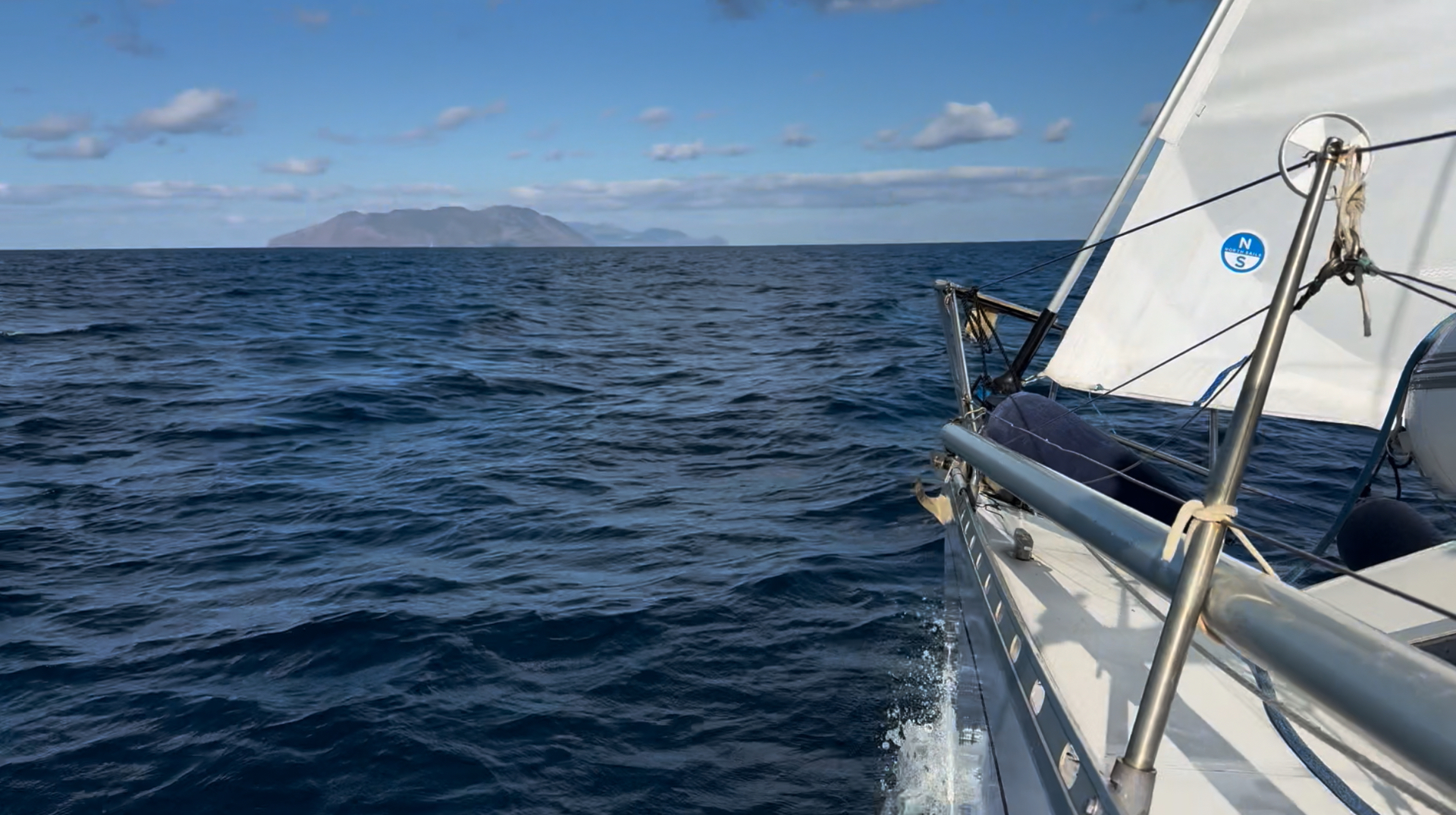 Looking forward along Nene's deck towards an island across open water